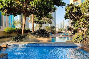 Outdoor pool, pool loungers - bnbme - The Lofts Central - 2 BDR (Dubai)
