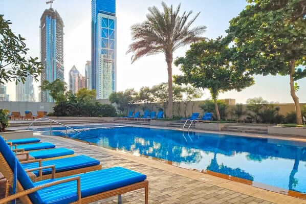 Outdoor pool, pool loungers - bnbme - The Lofts Central - 2 BDR (Dubai)
