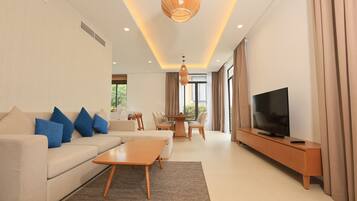 Deluxe Villa, Patio, Pool View | Living area | LCD TV