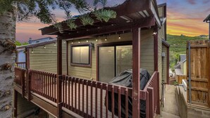 A wooden deck with a pergola, a covered patio area, and a view of a hilly landscape. - Labor Day Sale - Limited Time Offer, Save up to 30% (Park City)