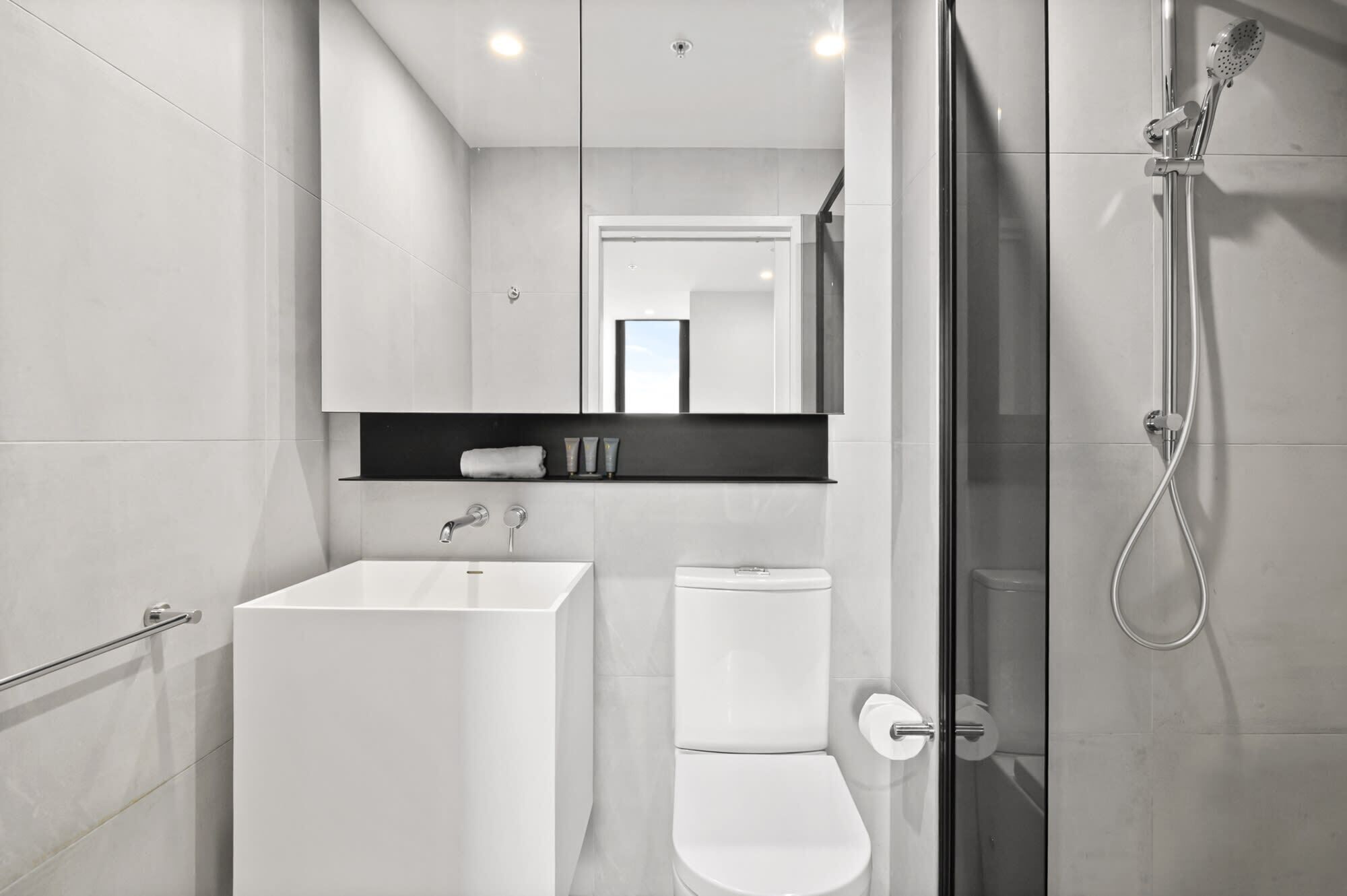 Shower, hair dryer, towels, shampoo