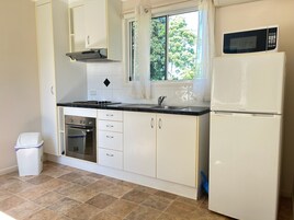 Fridge, microwave, cookware/dishes/utensils