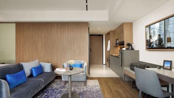 Junior Suite | Living area | 40-inch Smart TV with digital channels