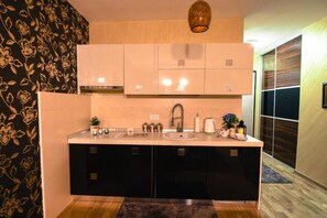 Fridge, oven, stovetop, dining tables