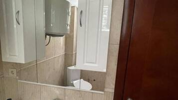 Douche, sĂšche-cheveux