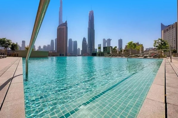 Outdoor pool, pool umbrellas, pool loungers