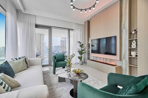 Premium Apartment, City View | Living room | 65-inch Smart TV with cable channels - bnbme - Downtown Views II - Tower 1 (Dubai)