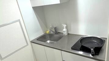 Mini-fridge, microwave, stovetop, cookware/dishes/utensils