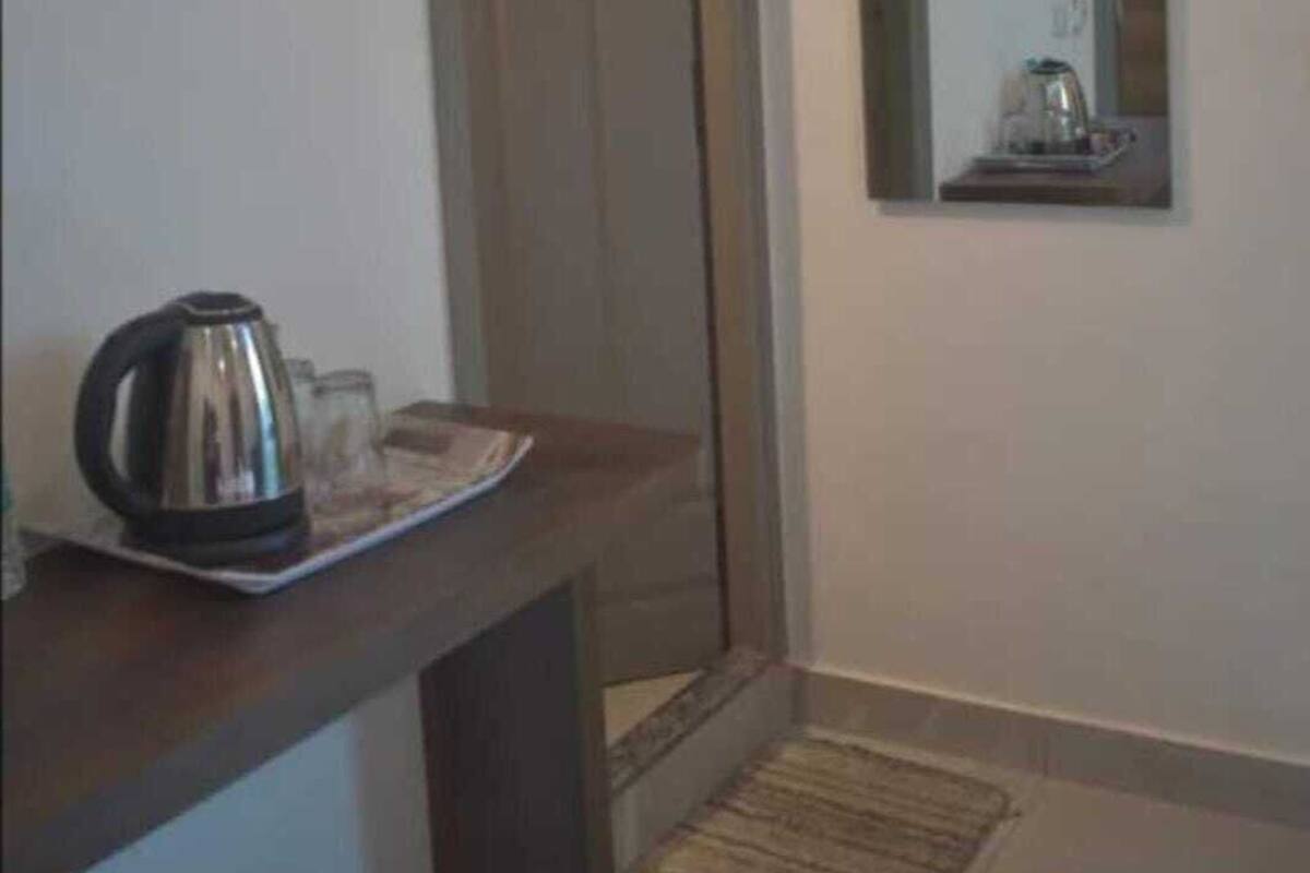 Premium bedding, desk, laptop workspace, soundproofing