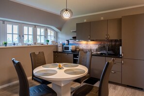 Dining - Modern gallery apartment with balcony view of the Puddeminer Wiek! (Poseritz)