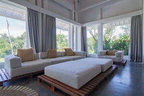 Grand Double Room, Pool View | Living area - Outsite Bali (Canggu)