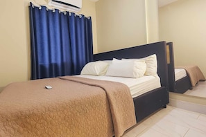 Economy Studio Suite, Balcony, City View | Laptop workspace, iron/ironing board, free WiFi