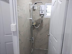 Economy Studio Suite, Balcony, City View | Bathroom | Slippers, towels, soap, shampoo