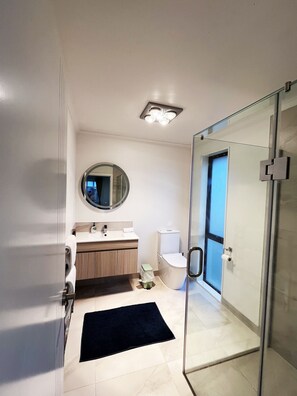 Shower, hair dryer, towels, toilet paper