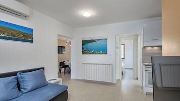 Family House, Multiple Bedrooms (Seaview Pool House Mytilus) | Living area | 21-inch Smart TV with satellite channels