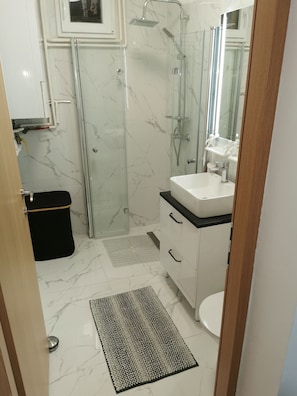 Shower, hair dryer, towels, soap