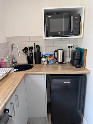 Fridge, microwave, toaster, cookware/dishes/utensils