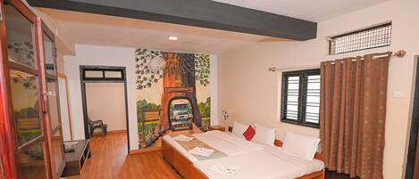 Un dormitorio con cama de madera, un escritorio y un mural en la pared.