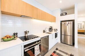 Coffee/tea maker, fridge, microwave, oven
