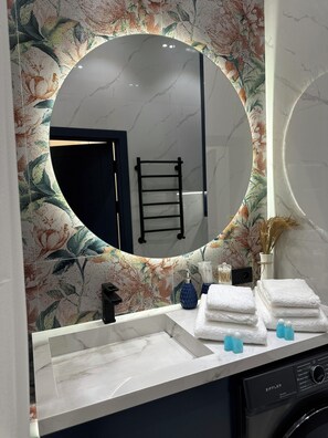 Hair dryer, bidet, towels, soap