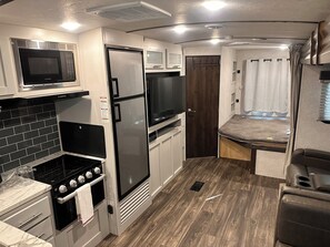 Private kitchen - Bullet Travel trailer with Texas skyline views! (Whitney)