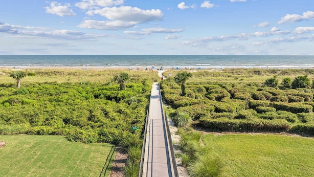 A boardwalk leading to a beach with a clear sky and distant horizon. - Island Condo for 6 w Communal Pool - Perfect Spot! (Hilton Head Island)