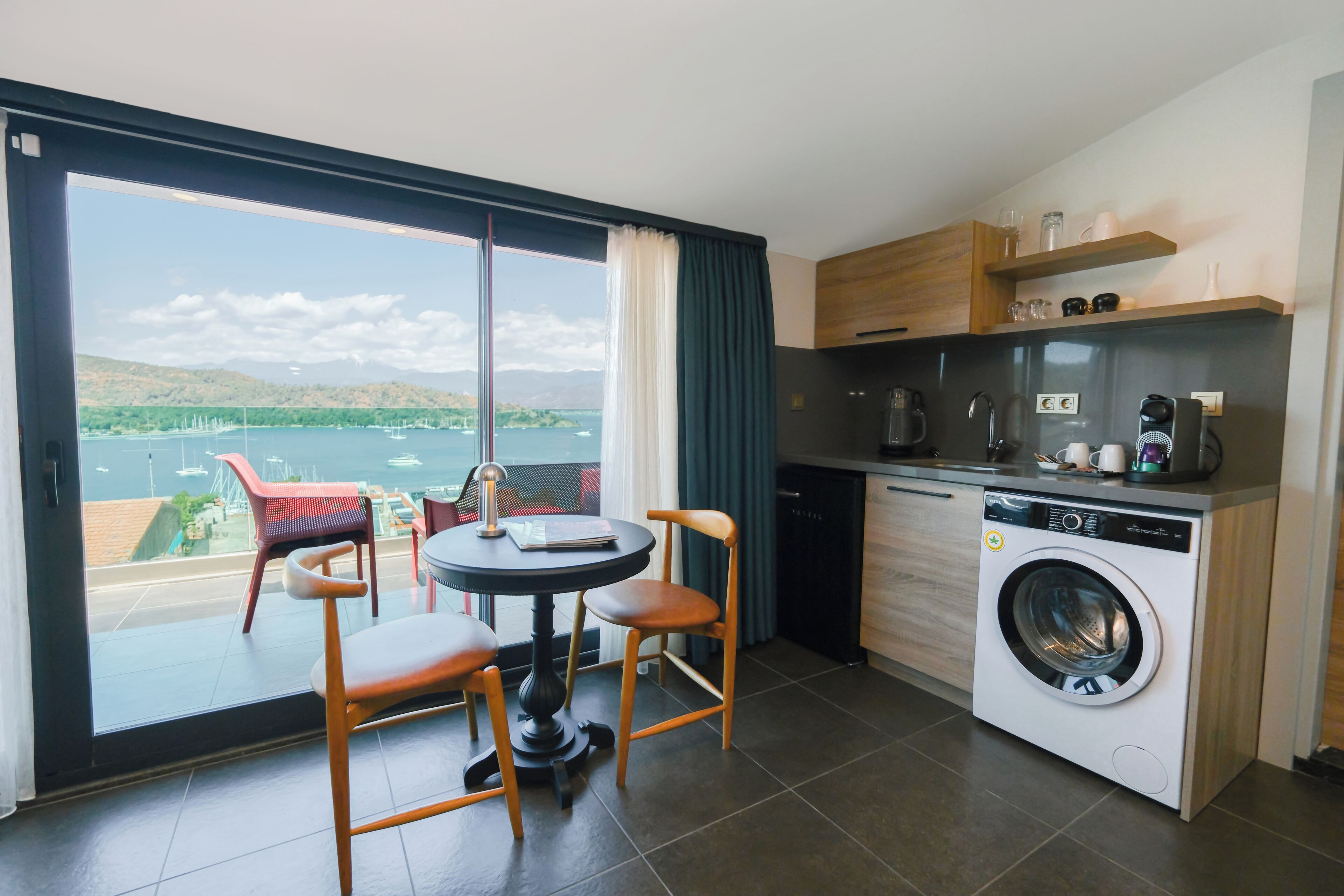 Luxury Suite, Sea View | Private kitchen | Espresso maker, electric kettle, highchair