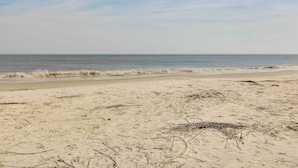 A sandy beach with waves and a clear sky. - Poolside Fun & Ocean Strolls: Harbor Island Haven! (Harbor Island)