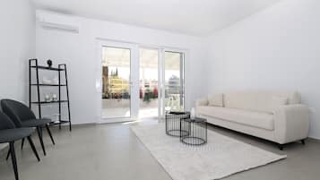 Superior One Bedroom Apt Partial SeaView | Living area | Flat-screen TV