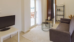 Superior Two Bedroom Apartment Sea View | Living area | Flat-screen TV