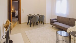 Superior Two Bedroom Apartment Sea View | Living area | Flat-screen TV