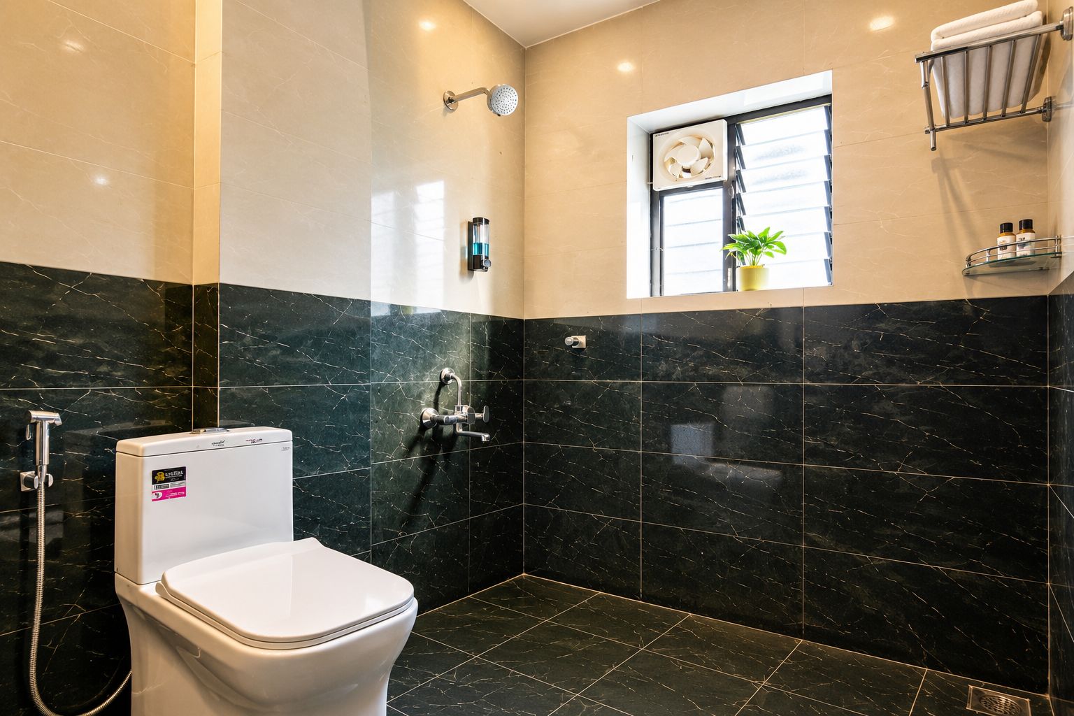 A bathroom with a toilet, a shower, and a window with a plant.