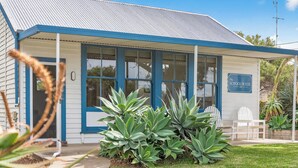 A building with a blue exterior, large windows, and a sign that reads 'The School House.' - 5 Rosetta Place, Hayborough (Hayborough)