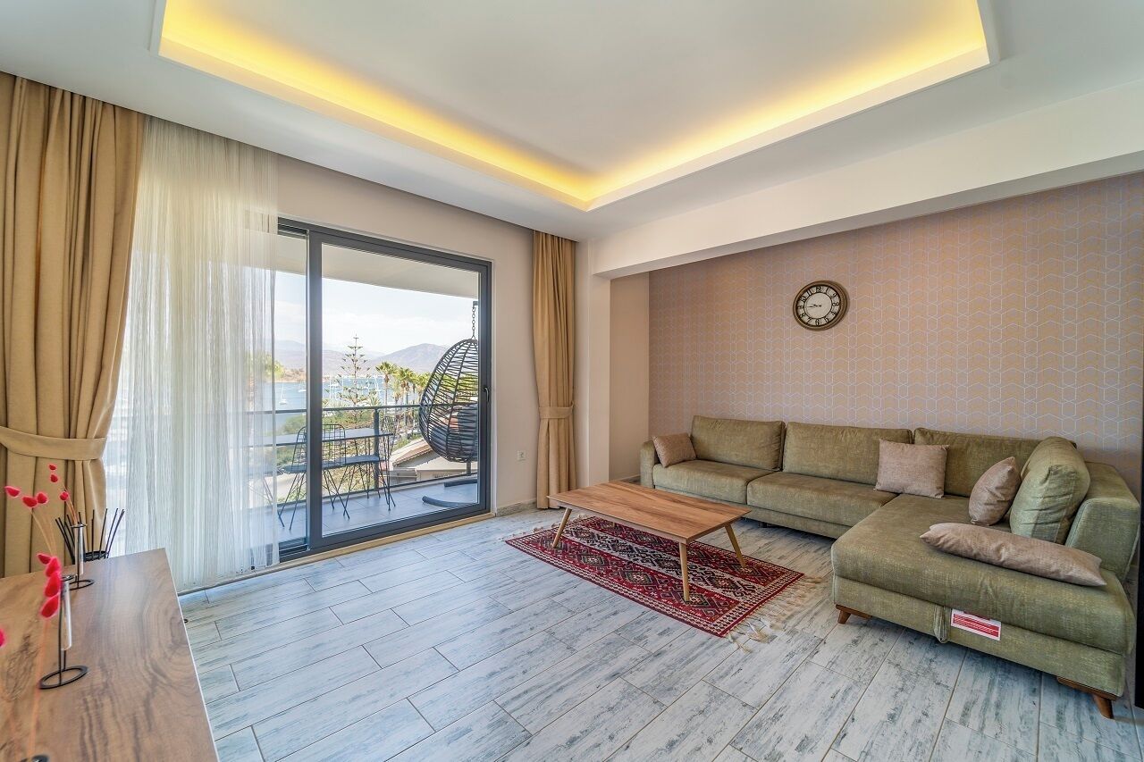 Standard Suite, 1 Queen Bed, Sea View | Living area | 50-inch Smart TV with cable channels