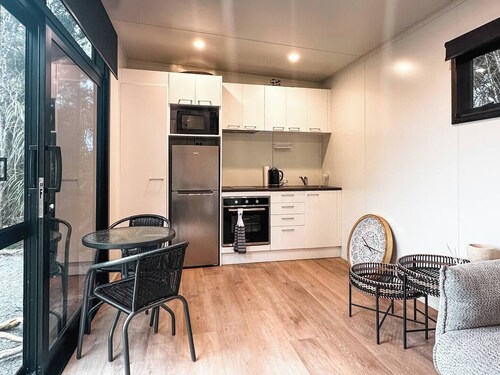 Perched on a peaceful ridge above the Tasman Sea, Luna Ridge Hokitika offers a modern yet cozy retreat.