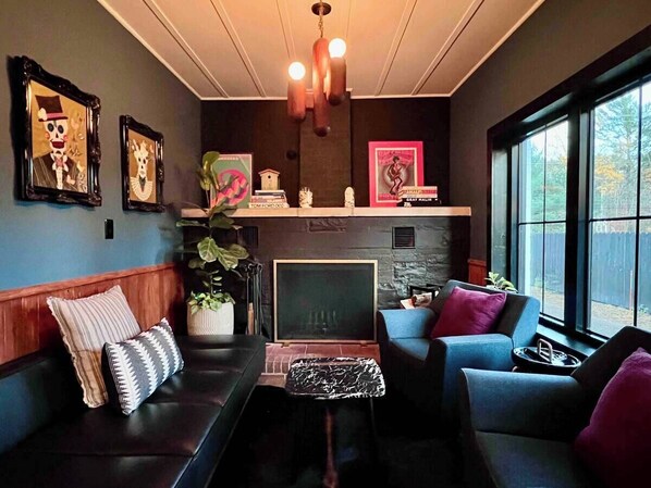 TV, fireplace, books