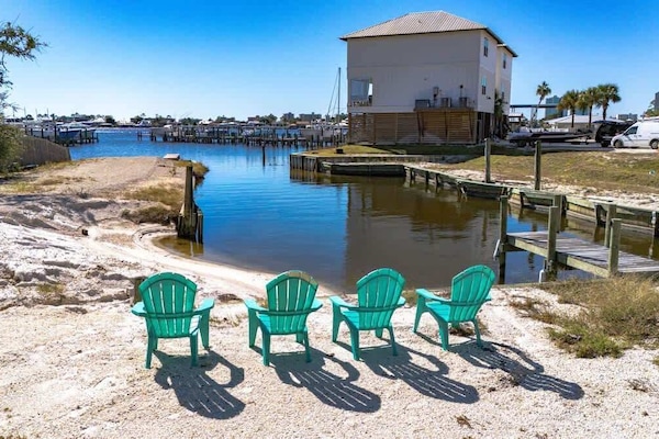 Relax by the water with stunning lagoon views, comfortable Adirondack seating, and peaceful access to the marina perfect for morning coffee, sunset chats, or simply unwinding by the shoreline.