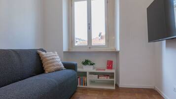 Apartment, 1 Bedroom | Living area | 30-inch TV with satellite channels