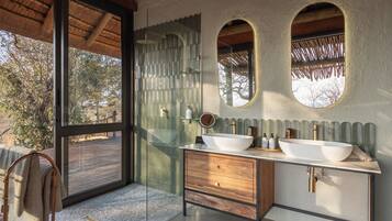 Separate bathtub and shower, hair dryer, slippers, towels