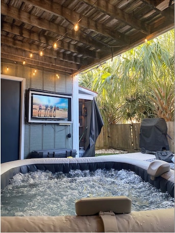 Outdoor spa tub. Luxury Townhouse near Downtown and Beaches with Hot Tub