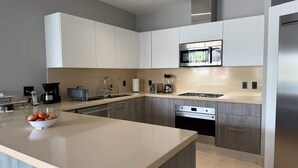 Fridge, microwave, oven, stovetop - Luxury 4BR + Service Room Resort Condo | Pool, Beach & Lake | Buenaventura, Panama (El Chirú)