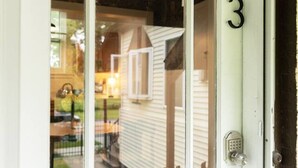 A white door with a glass panel and a number '3' on it. - Peaceful, Artsy North Troy Riverview Apt (Troy)