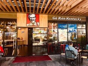 A restaurant with a prominent logo and signage. - Dalat Center Residence (Dalat)