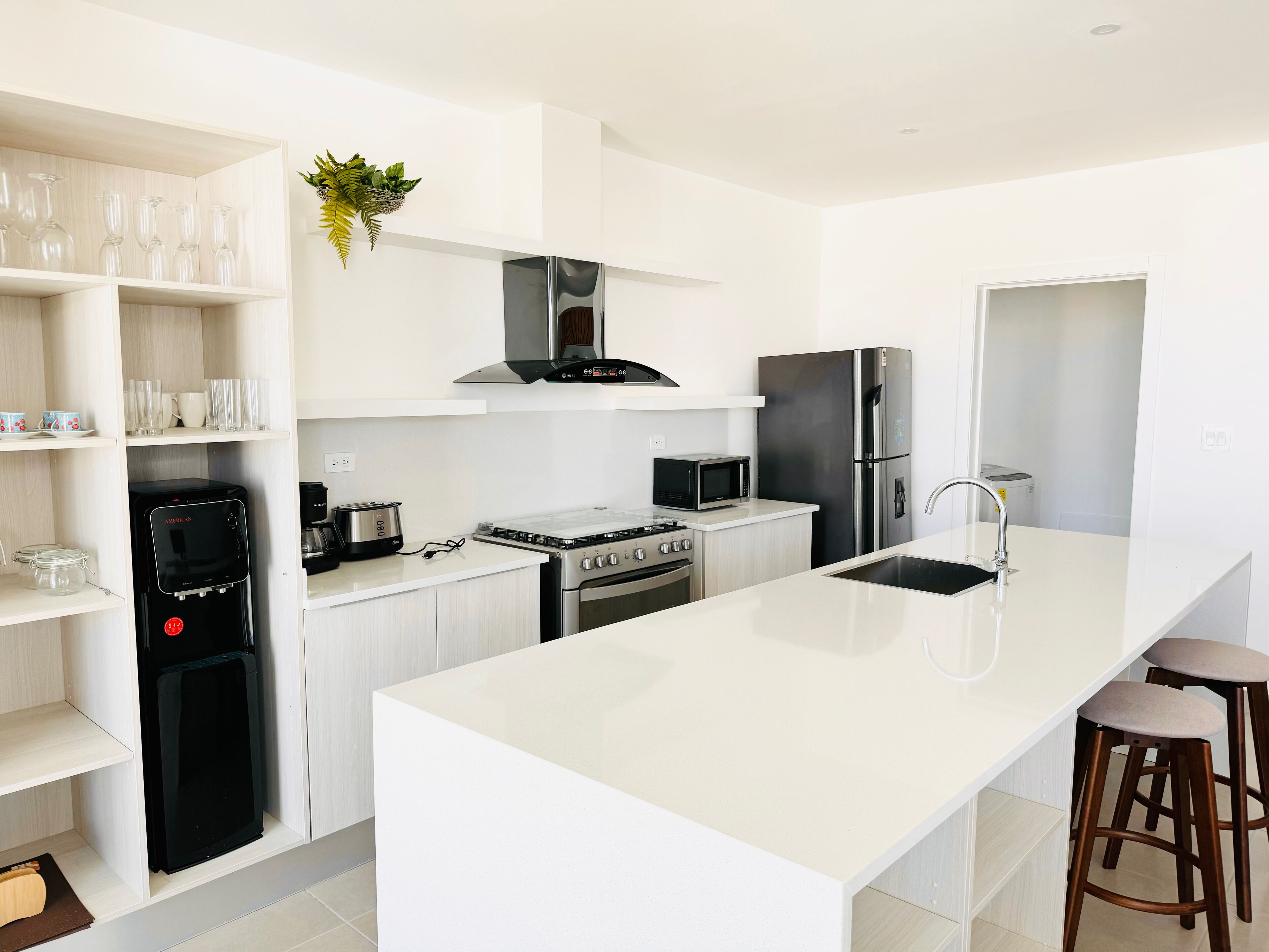 Full-sized fridge, microwave, high chair, cookware/dishes/utensils