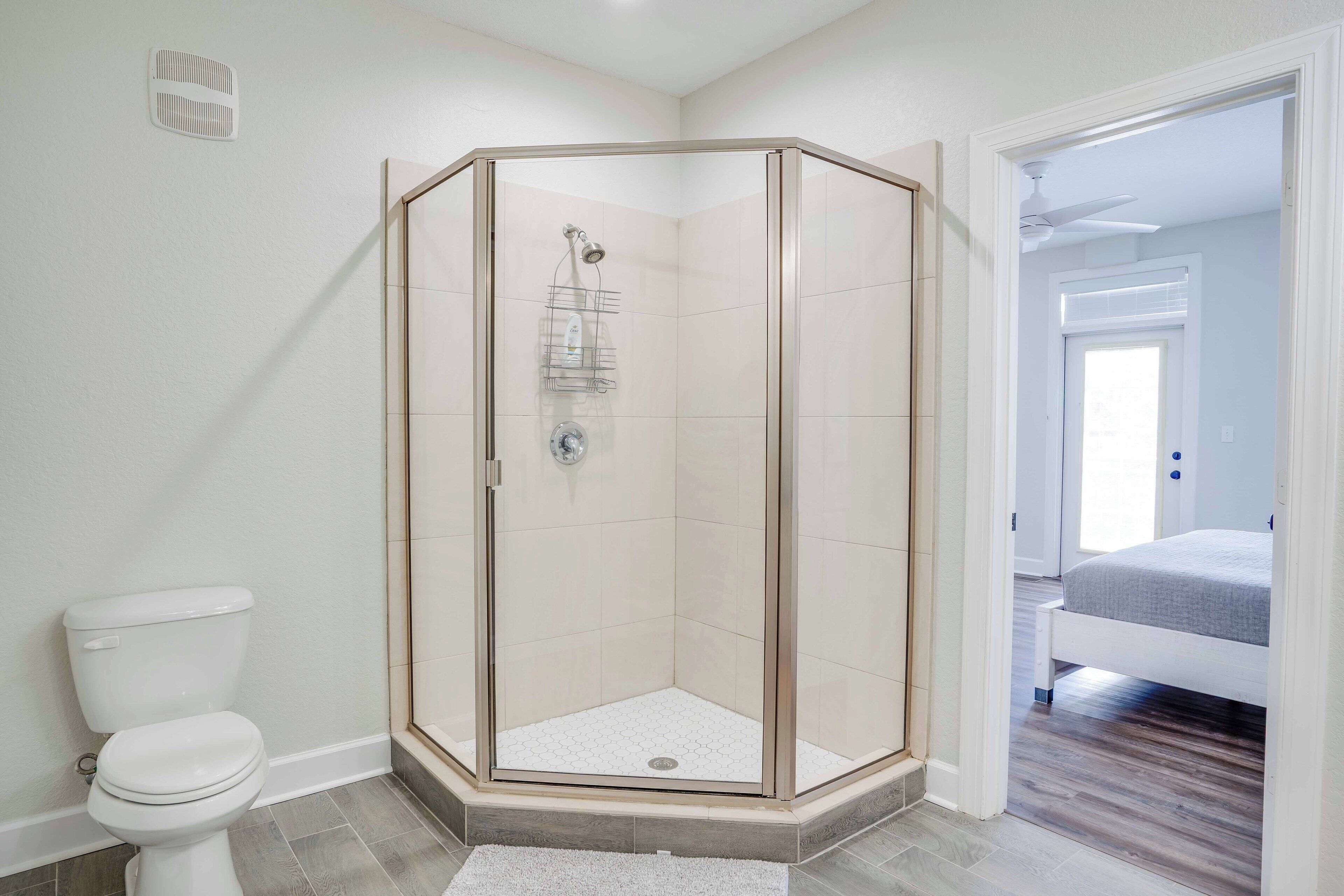 Shower, hair dryer, towels, toilet paper