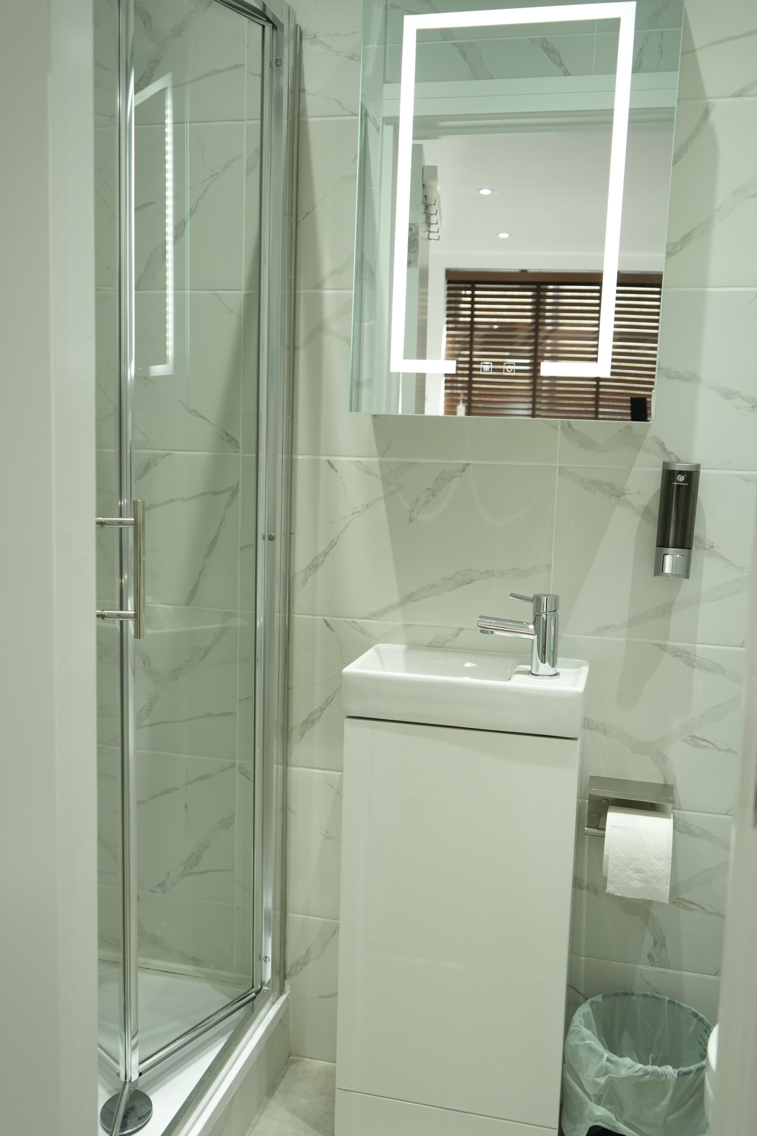 Superior Studio Suite, 1 King Bed | Bathroom | Shower, hair dryer, slippers, towels