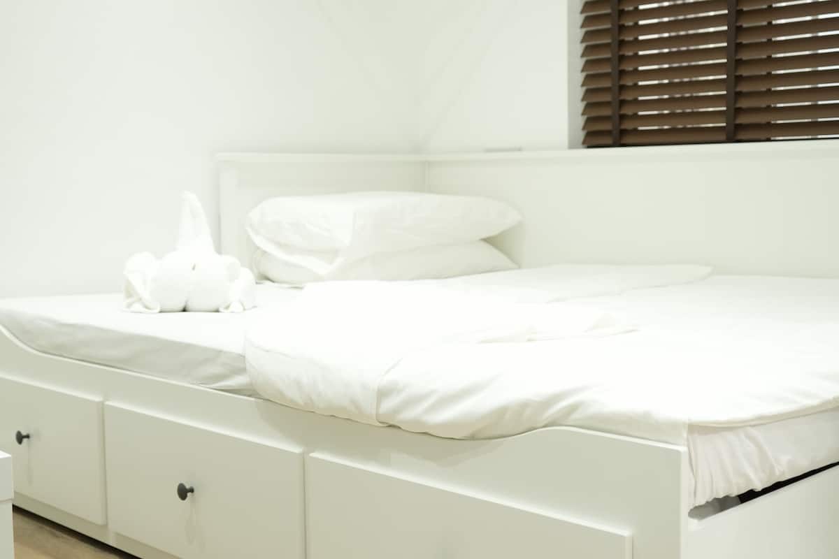 Premium bedding, desk, blackout curtains, soundproofing