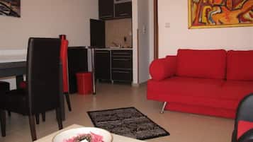 Apartment (One Bedroom Apartment With Sea View () | Living room | 32-inch flat-screen TV with cable channels