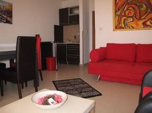 Apartment (One Bedroom Apartment With Sea View () | Living room | 32-inch flat-screen TV with cable channels