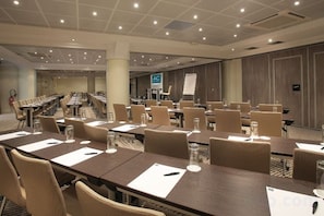 A conference room with long tables, chairs, and a whiteboard. - AC Hotel by Marriott Ambassadeur Antibes - Juan Les Pins (Juan-les-Pins)